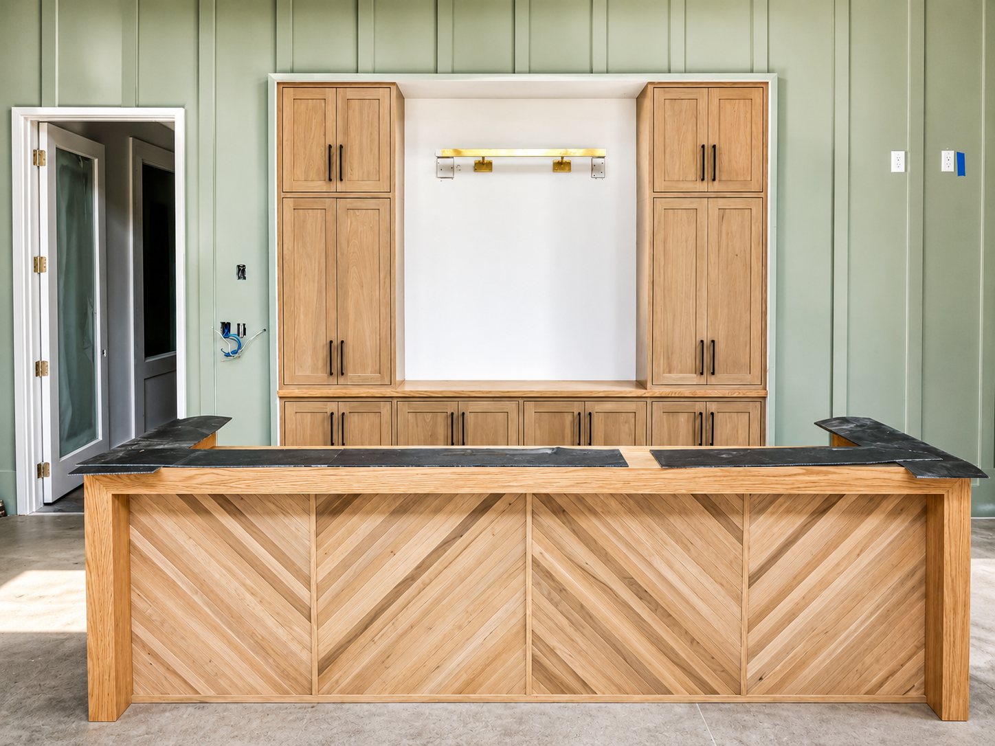 Custom built-in cabinetry with green accent walls