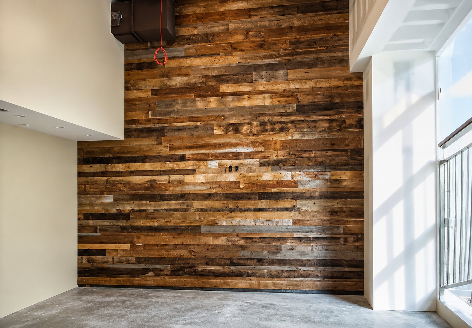 Reclaimed wood accent wall in a sunlit space