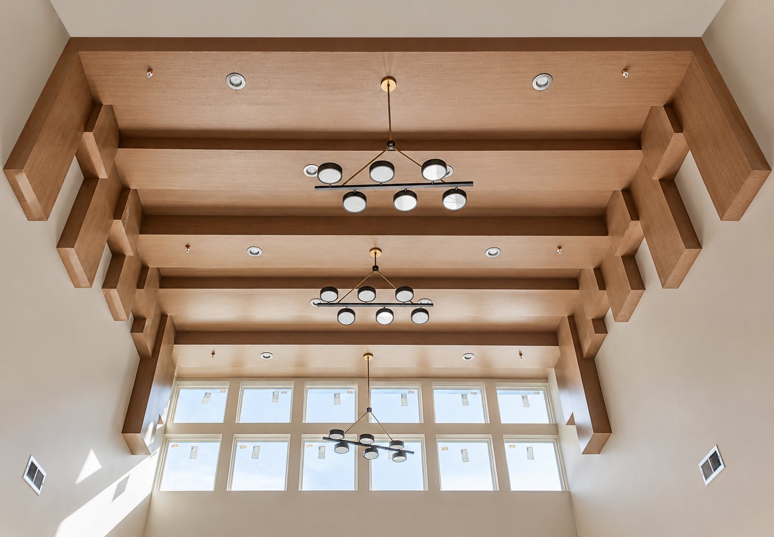 Coffered beam ceiling with ring chandeliers